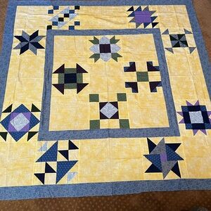 Patchwork Quilt Top with Yellow and Blue Accents
With backing